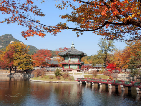 Korean traditional architecture Gyeongbokgung Palace Hyangwonjeong at colorful autumn leaves in Seoul, Korea