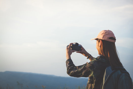 Asian  Young Women People Hiking With Friends Backpacks Walking Together And Looking Map And Taking Photo Camera By The Road And Looking Happy ,Relax Time On Holiday Concept Travel