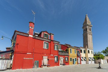 Colorful residential building and campanile in Burano island, Venice, Italy.