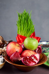 Traditional Azerbaijan of holiday Nowruz. Fruits and Fresh green grass samani symbol of spring