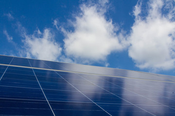 The solar panel tracking system with cloud and blue sky