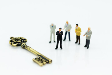 Miniature people: Group Businessmen stand with master key. Image use for key man, the key to...