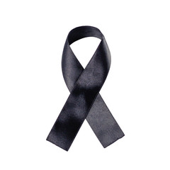 Black ribbon on a white background. Folded ribbon. Close up
