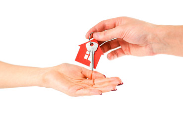 The hand holds the keys with the red house keychain. Purchase of apartments. House in hands. Close up. Isolated on a white background