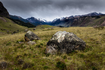 Fototapeta na wymiar A rock in the middle of the valley with the Mountains in the background in Patagonia
