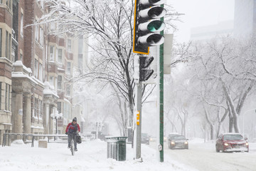 cyclist in a snow storm day