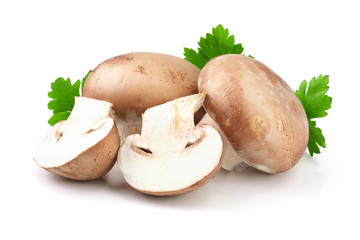 Royal Brown champignon with half and parsley leaf isolated on white background