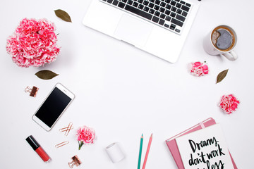 Woman workspace with handwritten quote notebook, pink carnation flower, coffee cup and lipstick on white background. Flat lay, top view. stylish female blogger concept. Inspiration words.