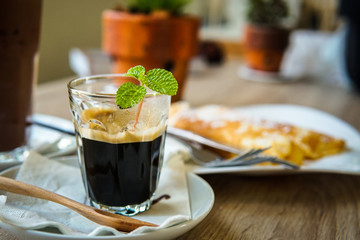 Coffee, espresso and mint for morning wake up with some crape cake for breakfast.
