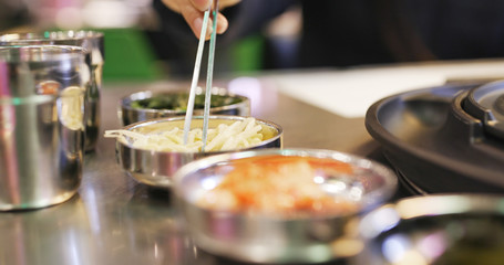 Having korean appetizer in restaurant