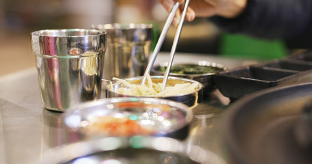 Having korean appetizer in restaurant