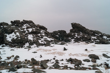 Rocks of the mountain against the sky. Landscape of the Far East coast of Russia