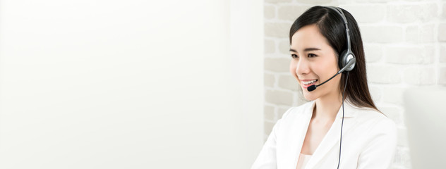 Beautiful Asian woman customer service agent in call center, panoramic banner