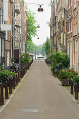 Fototapeta na wymiar Traditional view on dutch houses and town street in summer day. Netherlands