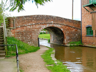 Old bridge with towpath on the Shropshire Union canal in Market Drayton, England