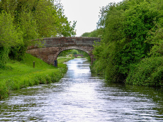 Old stone bridge on the Shropshire Union Canal in England.