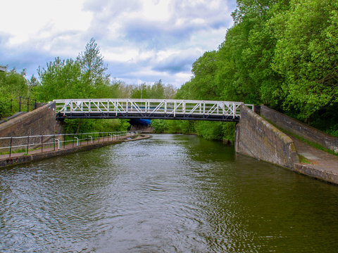 Fototapeta Black and white steel bridge over the Trent and Mersey Canal near Stoke-on-Trent in Staffordshire, England.