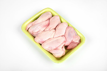 raw chicken wings package isolated on white background