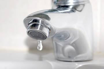 Closeup Image faucet  . water saving concept