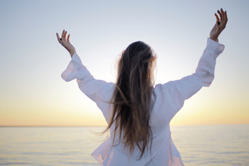 Girl at sea view from behind concept freedom rest happiness