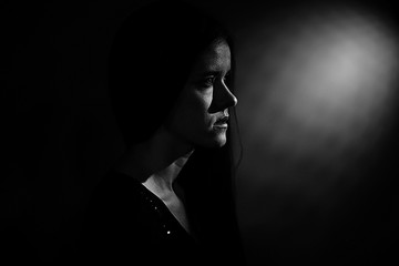 girl on black background studio portrait