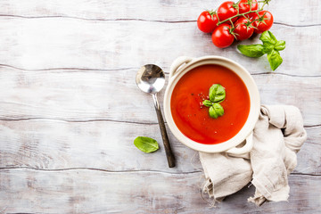 Tomato soup on wooden table