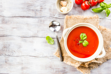 Tomato soup on wooden table