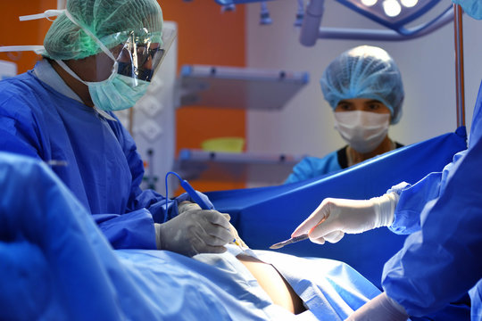 Team surgeon at work on operating room in hospital