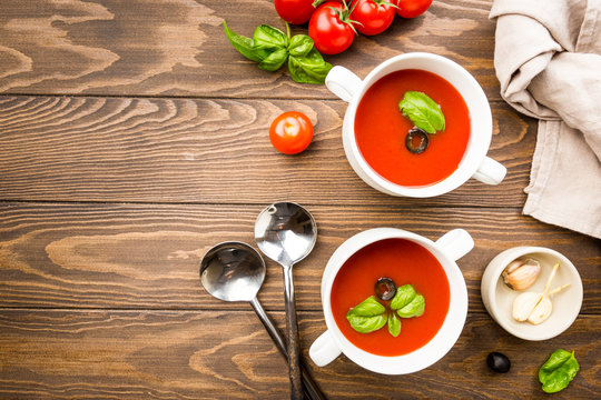 Tomato soup on wooden table