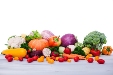 Fresh vegetables on wooden table. Isolated.