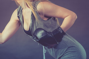 Boxer girl exercise with boxing gloves.