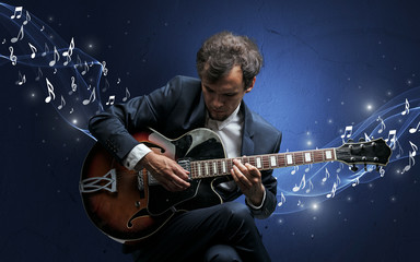Obraz na płótnie Canvas Lonely composer playing on guitar