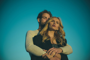 Muscular man and woman with long blond hair, love.