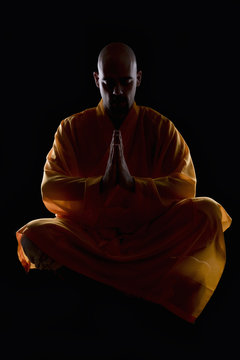 Premium Photo  Monk meditating near bonfire rear view