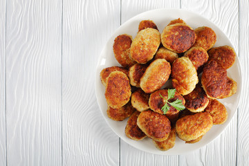 fried hot meat cutlets on white plate