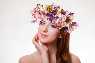 portrait of a young redhead girl with flower wreath