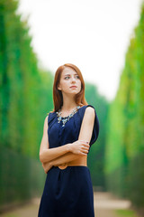 girl in blue dress posing in Garden of Verssailles