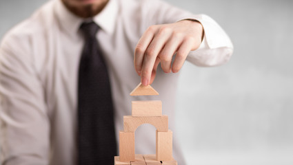 Businessman building a tower