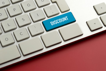 Computer key showing the word DISCOUNT