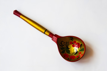 Wooden spoon with Khokhloma pattern