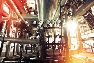 Equipment, cables and piping as found inside of a modern industrial power plant