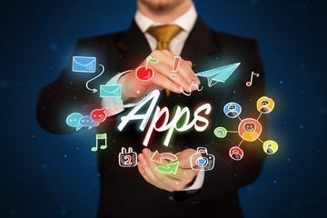 Businessman holding apps