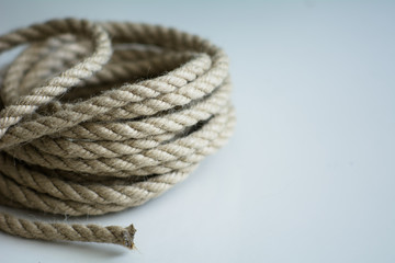 Coarse rope roll on a white surface