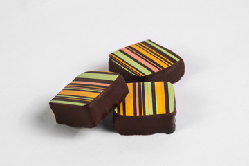 Handmade chocolate candy with filling isolated on white