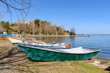 Naklejka na ściany i meble fishing boat on beach at the village of Marta, Bolsena lake, Italy