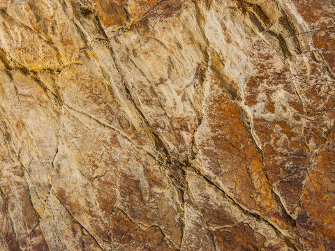 Natural cut stone. Colorful natural stone texture. Stone texture background. Detailing the texture of the stone.