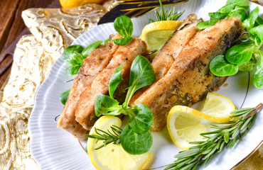 Fried carp fillet on wintry salad