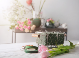 Florist equipment with flowers on table
