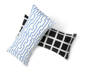 Soft decorative pillows on white background