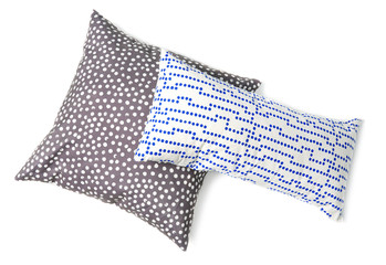 Soft decorative pillows on white background